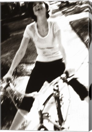 Framed Young woman riding a bicycle - black &amp; white Print