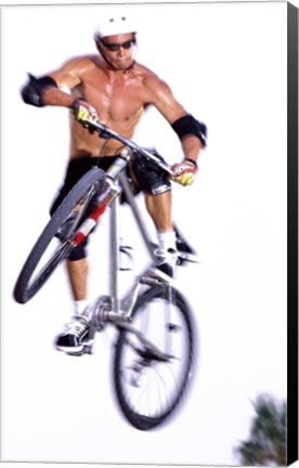 Framed Young man on a bicycle in mid-air Print