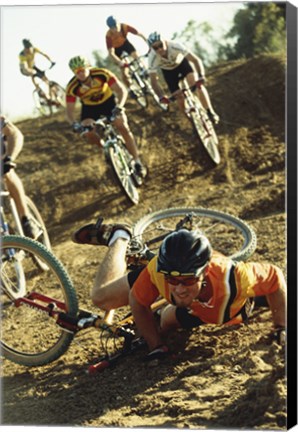 Framed Young man falling off his bicycle in a race Print