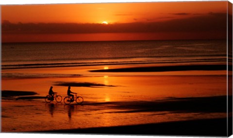 Framed Silhouette of a young couple cycling on the beach Print