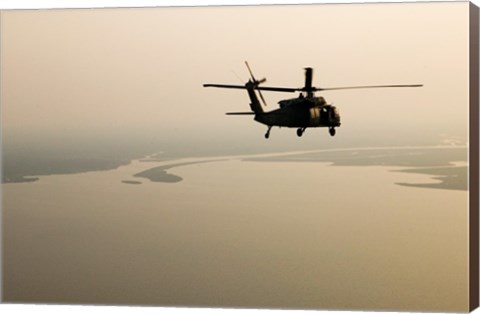 Framed Air Force helicopter flys over Lake Pontchatrain to New Orleans Print