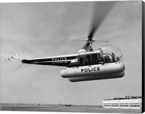 Framed Low angle view of a helicopter in flight, Bell 47-D, Bell Aircraft Corporation Print