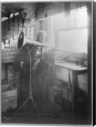 Framed Thomas Alva Edison, full-length portrait, standing, facing right, listening to a new record Print