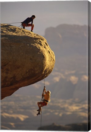 Framed View of rock climbers on the edge of a cliff Print