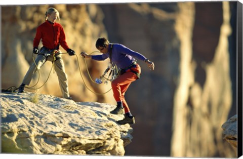 Framed Two hikers with ropes at the edge of a cliff Print