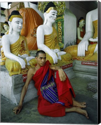 Framed Monk Sitting in Front of a Buddha Statue Print