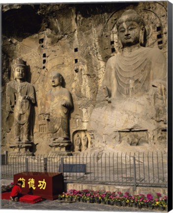 Framed Buddha Statue in a Cave, Longmen Caves, Luoyang, China with Flowers Print