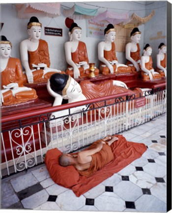 Framed Monk Sleeping in Front of Buddha Statues Print