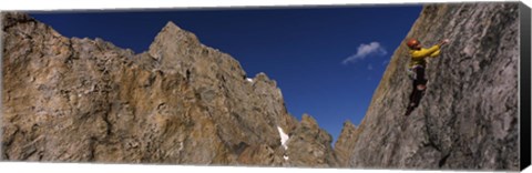 Framed Man climbing up a mountain, Grand Teton, Grand Teton National Park, Wyoming, USA Print