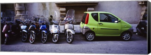 Framed Motor scooters with a car parked in a street, Florence, Italy Print