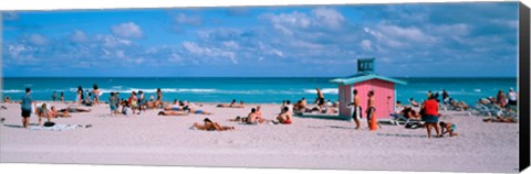 Framed Tourist on the beach, Miami, Florida, USA Print