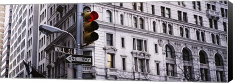 Framed Low angle view of a Red traffic light in front of a building, Wall Street, New York City Print
