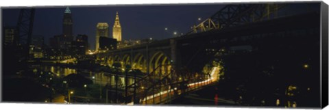 Framed Arch bridge and buildings lit up at night, Cleveland, Ohio, USA Print