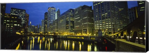 Framed Low angle view of buildings lit up at night, Chicago River, Chicago, Illinois, USA Print