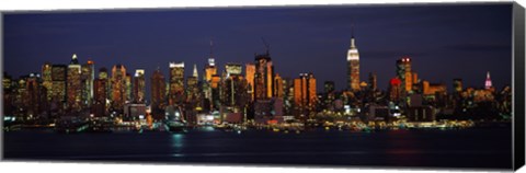 Framed Skyscrapers lit up at night in a city, Manhattan, New York City, New York State, USA Print