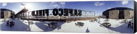 Framed Tourist sitting on a roof outside a baseball stadium, Seattle, King County, Washington State, USA Print