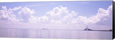 Framed Sea with a container ship and a suspension bridge in distant, Sunshine Skyway Bridge, Tampa Bay, Gulf of Mexico, Florida, USA Print