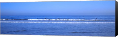 Framed Surfers riding a wave in the sea, Santa Monica, Los Angeles County, California, USA Print