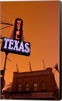 Framed Low angle view of a neon sign of a hotel lit up at dusk, Fort Worth Stockyards, Fort Worth, Texas, USA Print