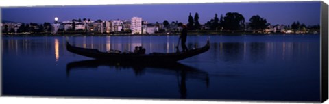 Framed Boat in a lake with city in the background, Lake Merritt, Oakland, Alameda County, California, USA Print