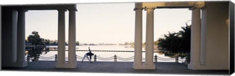 Framed Person stretching near colonnade, Lake Merritt, Oakland, Alameda County, California, USA Print