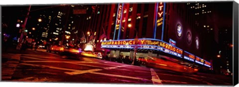 Framed Low angle view of buildings at night, Radio City Music Hall, Rockefeller Center, Manhattan, New York City, New York State, USA Print