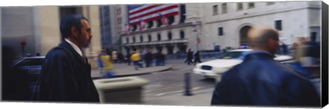 Framed Two people walking, New York Stock Exchange, Wall Street, Times Square, Manhattan, New York City, New York State, USA Print