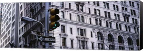 Framed Low angle view of a Green traffic light in front of a building, Wall Street, New York City Print