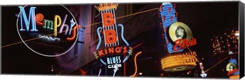 Framed Low angle view of neon signs lit up at night, Beale Street, Memphis, Tennessee, USA Print