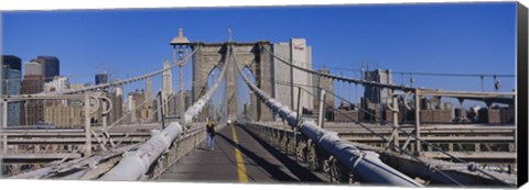 Framed Rear view of a woman walking on a bridge, Brooklyn Bridge, Manhattan, New York City, New York State, USA Print