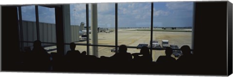 Framed Silhouette of a group of people at an airport lounge, Orlando International Airport, Orlando, Florida, USA Print