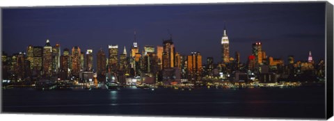 Framed Skyscrapers lit up at night in a city, Manhattan, New York City, New York State, USA Print