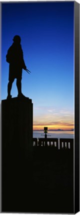 Framed Captain Cook monument silhouetted by sunset, Anchorage, Alaska, USA. Print