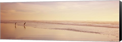 Framed Two children playing on the beach, San Francisco, California, USA Print