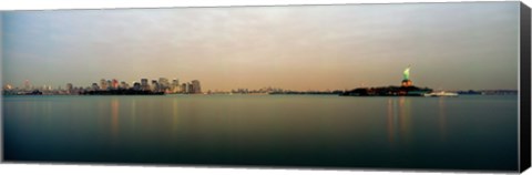 Framed River with the city skyline and Statue of Liberty in the background, New York Harbor, New York City, New York State, USA Print