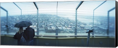 Framed Couple viewing a city from the Space Needle, Queen Anne Hill, Seattle, Washington State, USA Print