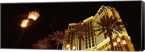 Framed Low angle view of a hotel lit up at night, The Strip, Las Vegas, Nevada, USA Print