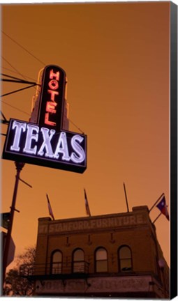 Framed Low angle view of a neon sign of a hotel lit up at dusk, Fort Worth Stockyards, Fort Worth, Texas, USA Print