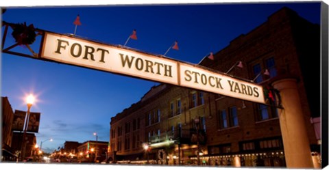 Framed Signboard over a road at dusk, Fort Worth Stockyards, Fort Worth, Texas, USA Print