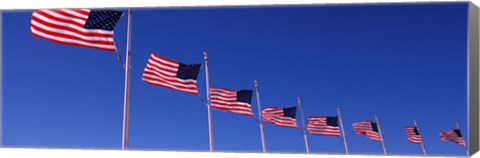 Framed Low angle view of American flags, Washington Monument, Washington DC, USA Print