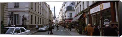 Framed Buildings along a street with a tower in the background, Rue Saint Dominique, Eiffel Tower, Paris, Ile-de-France, France Print