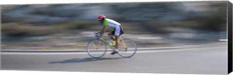 Framed Bike racer participating in a bicycle race, Sitges, Barcelona, Catalonia, Spain Print