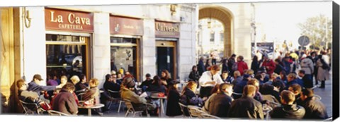 Framed Tourists sitting outside of a cafe, Barcelona, Spain Print