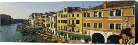 Framed Tourists looking at gondolas in a canal, Venice, Italy Print