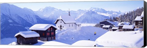 Framed Snow Covered Chapel and Chalets Swiss Alps Switzerland Print