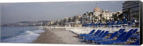 Framed Empty lounge chairs on the beach, Nice, French Riviera, France Print