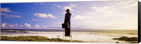 Framed Businessman Standing On A Ladder And Looking Through Binoculars, California, USA Print