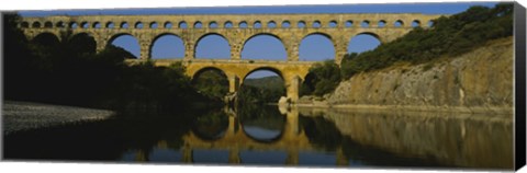 Framed Reflection of an arch bridge in a river, Pont Du Gard, France Print