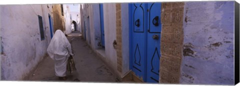 Framed Rear view of a woman walking on the street, Medina, Kairwan, Tunisia Print