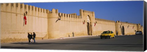 Framed Car on a road in front of a fortified wall, Medina, Kairwan, Tunisia Print